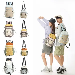 Outdoor multi-functional contrast color backpack and sling bag with practical drawstring details.