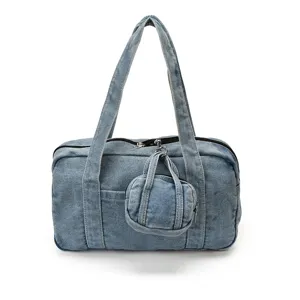 Detailed view of vintage washed denim tote bag for women, casual shoulder bag with mini pouch.