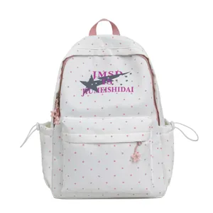 Close-up detail of the Japanese style polka dot student backpack front pocket and star print.