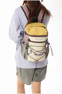 Stylish colorblock outdoor backpack with multi pockets, bungee cord, and casual daily design.