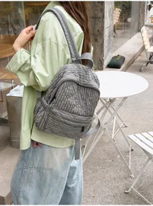 Grey plaid quilted backpack for women, lightweight school bag for daily commute and campus use.