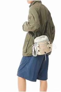 Multifunctional outdoor color-blocking crossbody backpack detail view with straps and pockets.