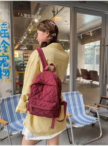 Quilted plaid backpack for women, lightweight casual school bookbag with adjustable straps.