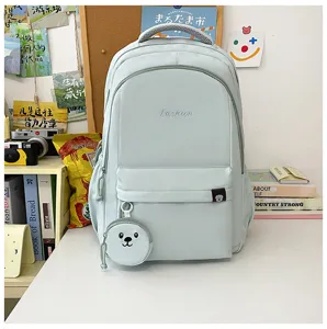 Zaino scolastico per studenti in nylon color caramella con ciondolo orso, grande capacità.