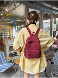 Casual plaid quilted backpack for women, lightweight school bookbag for daily commute and campus.