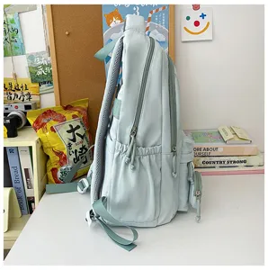 Zaino in nylon verde chiaro color caramella borsa scolastica studente vista dettagliata