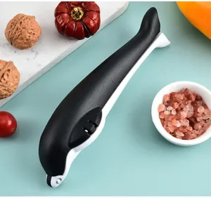 Detail view of the creative dolphin shaped chestnut opener, highlighting ergonomic grip.