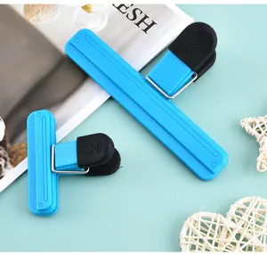 Closeup detail view of blue plastic food sealing clip for household snack freshness.