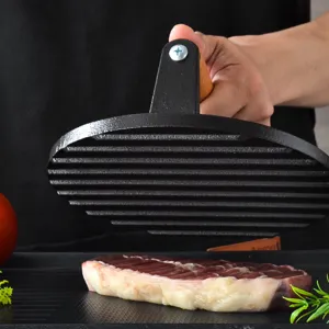 Cast iron burger press and steak weight with wooden handle for grill BBQ and kitchen.