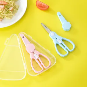 Stainless steel baby food scissors set with safety lock and storage case for infant feeding.
