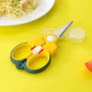 Stainless steel baby food scissors with safety lock and protective cover for kitchen use.