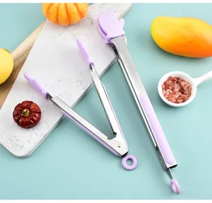 Detailed view of silicone food tongs with purple handles, perfect for kitchen barbecue and baking use.