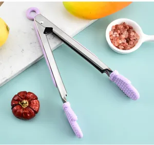 Detail shot of stainless steel food tong with purple silicone glove tips for kitchen use and BBQ.