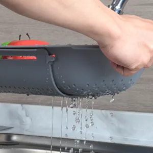 Panier égouttoir de cuisine rétractable en plastique pour évier, lavage et drainage rapide des légumes.