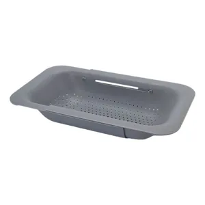 Panier d'evier de cuisine en plastique extensible pour laver legumes et vaisselle.