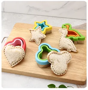 Stainless steel sandwich cutter details showing fun shapes like dinosaur and Mickey for kids.