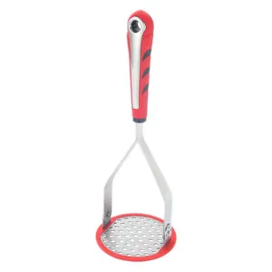 Stainless steel potato masher with ergonomic red silicone handle for kitchen cooking.
