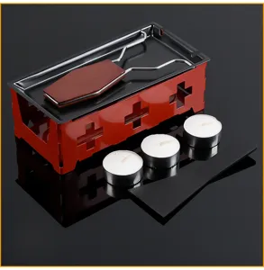 Mini stainless steel cheese melter set with red base, wooden handle spatula and tea light candles.