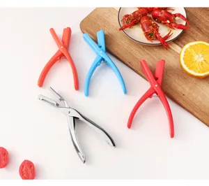 Stainless steel and plastic crayfish peeler detail showing convenient kitchen tools for seafood.