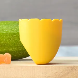 Yellow egg shell shaped anti splash guard accessory for kitchen fruit peeler guard safely.
