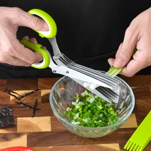 5-layer stainless steel kitchen herb scissors with ergonomic green handles for chopping scallions.