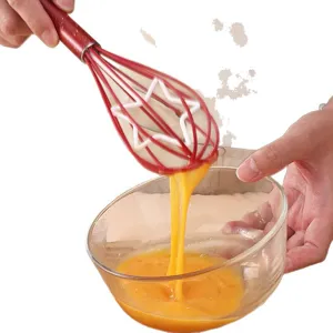 Frusta da cucina manuale in acciaio inossidabile con design a stella per dolci e panna.
