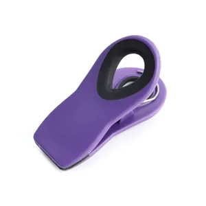 Purple magnetic food sealing clip, plastic fridge clip with black grip for kitchen storage.