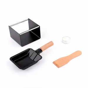 Mini cheese raclette grill set with non-stick pan wooden spatula and candle for kitchen.