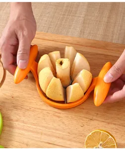 Stainless steel fruit slicer with ergonomic handles for quick core removal and wedge cutting.