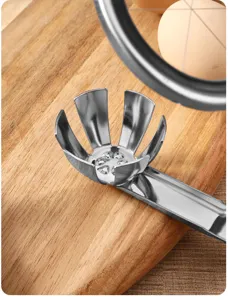 Stainless steel egg cracker detail shot showing the petal shaped bowl and handle tool.