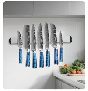 Stainless steel kitchen knife set with blue resin handles and wall-mounted magnetic storage rack.