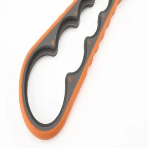 Multi-functional jar opener detail view, ergonomic non-slip orange and grey handle design.