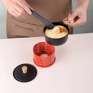 Portable mini round cheese melter set with wooden handle for convenient desktop cooking.