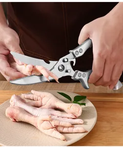 Heavy-duty stainless steel kitchen shears detail shot, perfect for cutting chicken bones effortlessly.