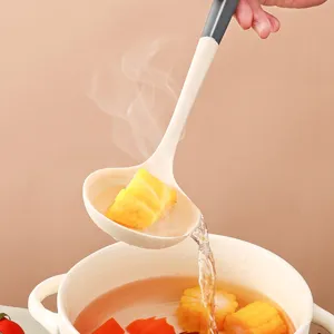 Ergonomic silicone soup ladle with dual color heat resistant handle for kitchen cooking use.