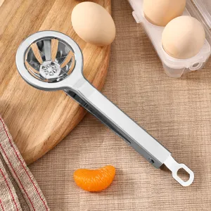 Stainless steel egg slicer kitchen tool for hard boiled eggs and soft fruits cutting.