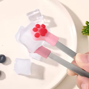 Stainless steel ice tongs featuring cute pink silicone cat paw grips, ideal for serving ice.