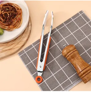 Stainless steel food tongs with heat resistant silicone handle for kitchen, grill.