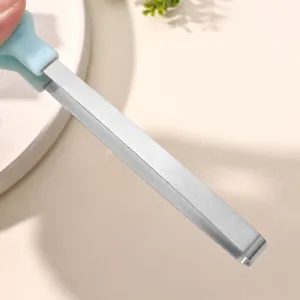 Stainless steel ice tong with cute silicone cat paw handle for sugar cubes and pastries.