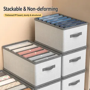 Stackable fabric clothes storage boxes with drawer design for wardrobe organization.