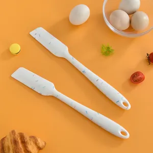 Set of two silicone spatulas with colorful sprinkles pattern for baking, cream, and jam.