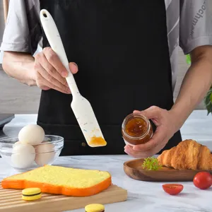 Seamless silicone spatula with colorful dot design for baking, jam and cream spreading.