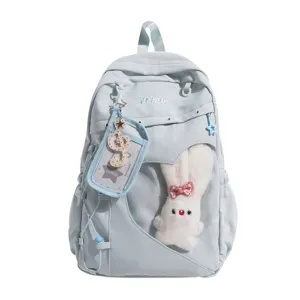 Niedlicher hellblauer Studentenrucksack mit transparenter Vordertasche und Plüschhase.