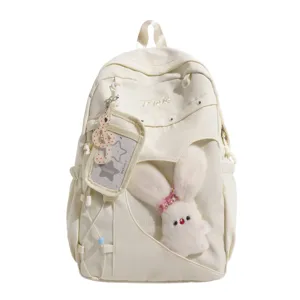 Schöner weißer Canvas-Schulrucksack mit transparenter Herztasche und Plüsch-Häschen-Anhänger.