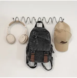 Vintage gewassen denim mini rugzak met bruine bandjes, veelzijdige casual dagrugzak voor dames.