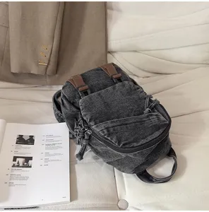 Vintage gewassen denim multifunctionele rugzak en borsttas, stijlvol unisex casual design.