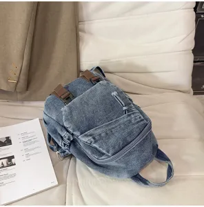 Gedetailleerd overzicht van de stijlvolle vintage gewassen denim multifunctionele rugzak.