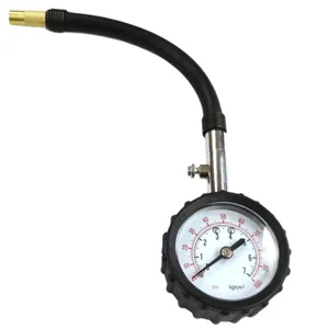 Mechanical tire pressure gauge with flexible rubber hose and dual scale dial for vehicle testing.