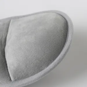 Soft grey plush fabric detail of baby car seat head support cushion, comfortable and cozy.