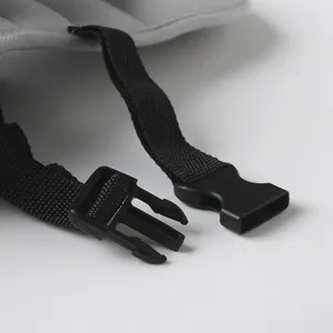 Detailed view of child car seat head support strap, adjustable buckle for safe baby sleep.